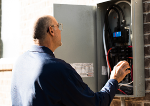WIN Home Inspector inspecting an electrical system